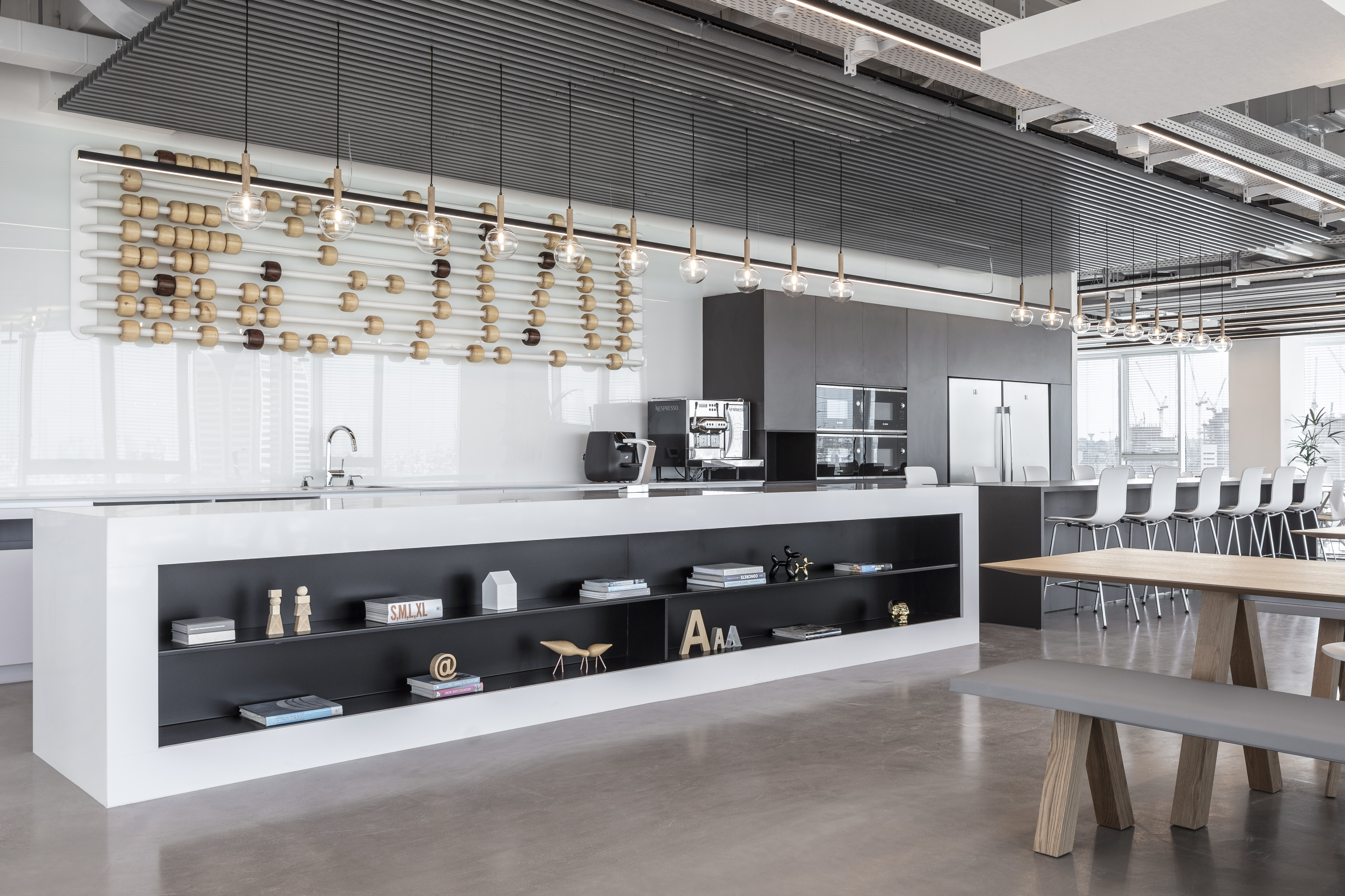 A room-sized abacus of wooden beads suspended over the kitchen island.