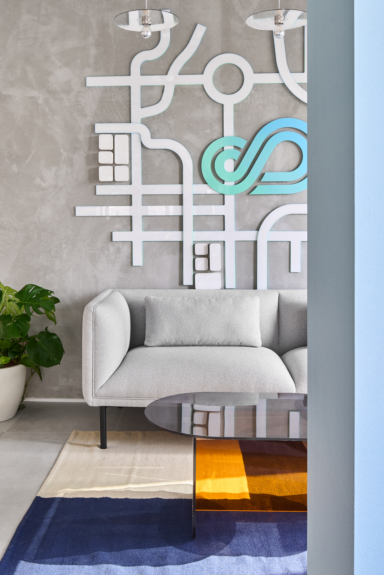 A white street-map relief across the lounge wall, the AutoFleet loop routed through it in teal.