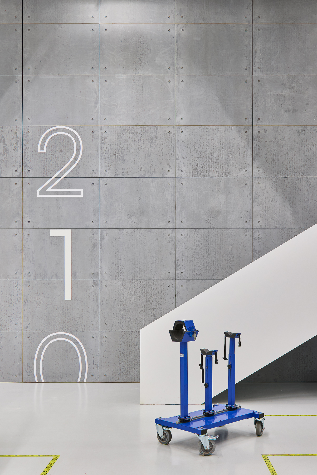 UVision wayfinding — aluminium signage with white illumination and black detailing.